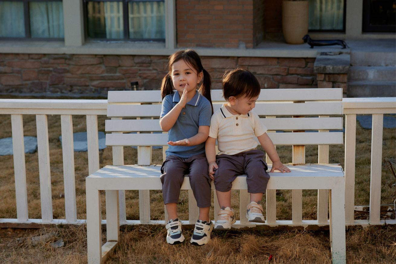 Twins sitting on the chair