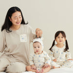 mom wearing blueberry pajama, baby boy wearing blueberry onesie, baby girl wearing blueberry pajama