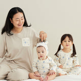 mom wearing blueberry pajama, baby boy wearing blueberry onesie, baby girl wearing blueberry pajama