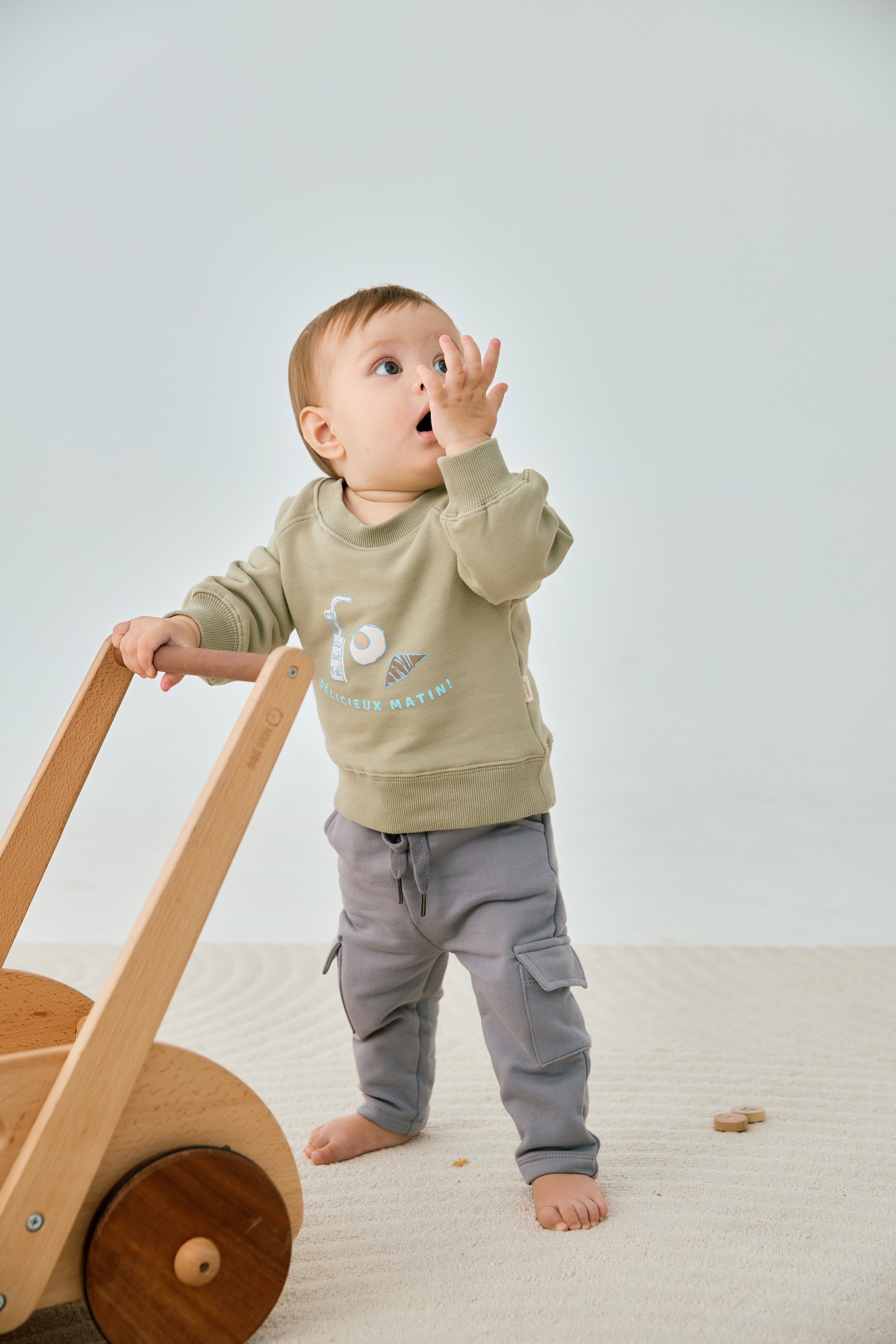 model wearing Organic Toddler Cargo Fleece Sweatpants-Grey