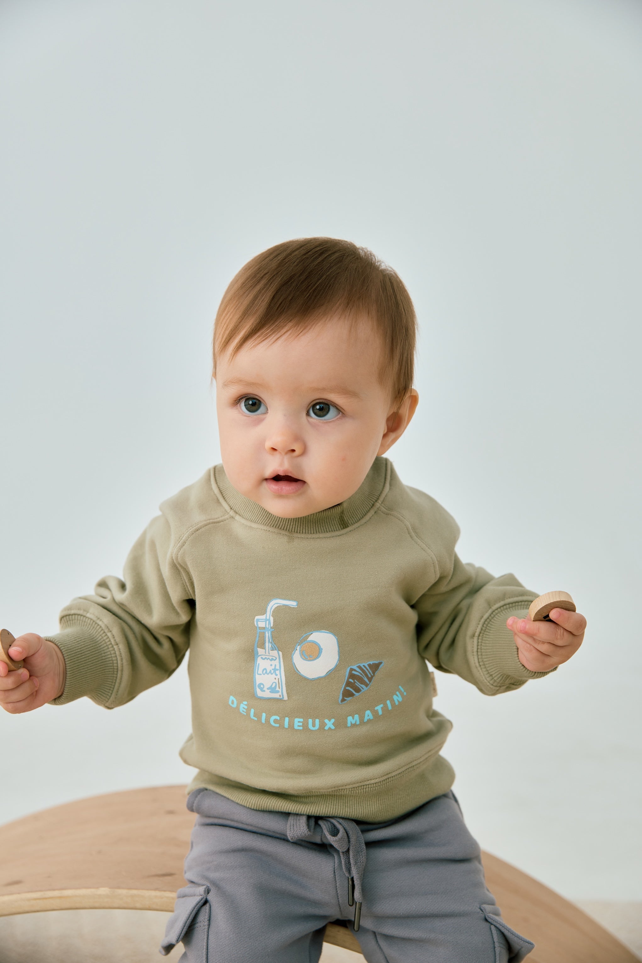 baby wearing Toddler Organic Fleece Sweatshirt-Milky