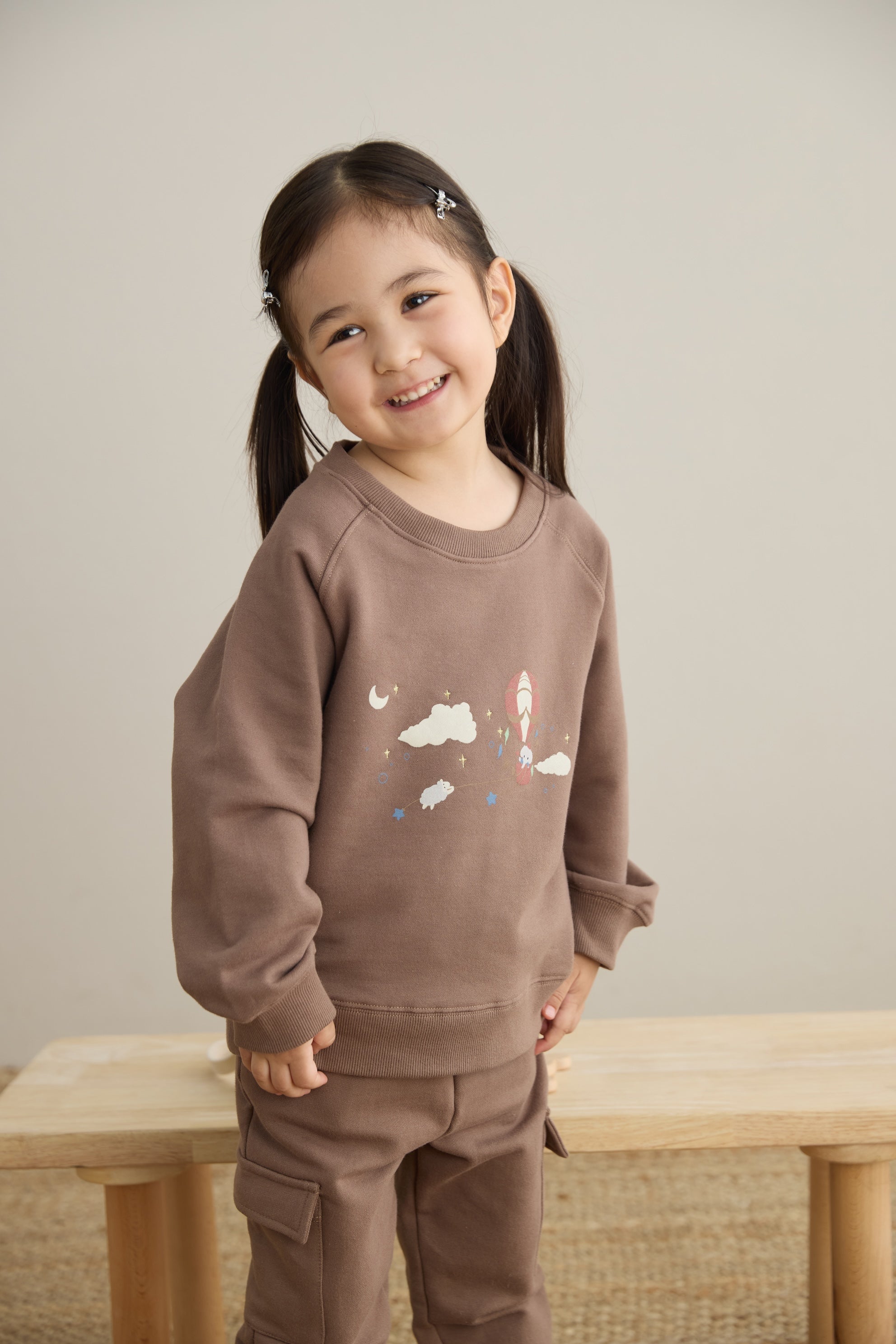 baby smiling and wearing Toddler Organic Fleece Sweatshirt-Fantasy