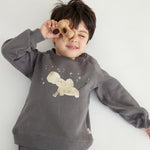 model lay down and wearing Toddler Organic Fleece Sweatshirt-Dark Grey