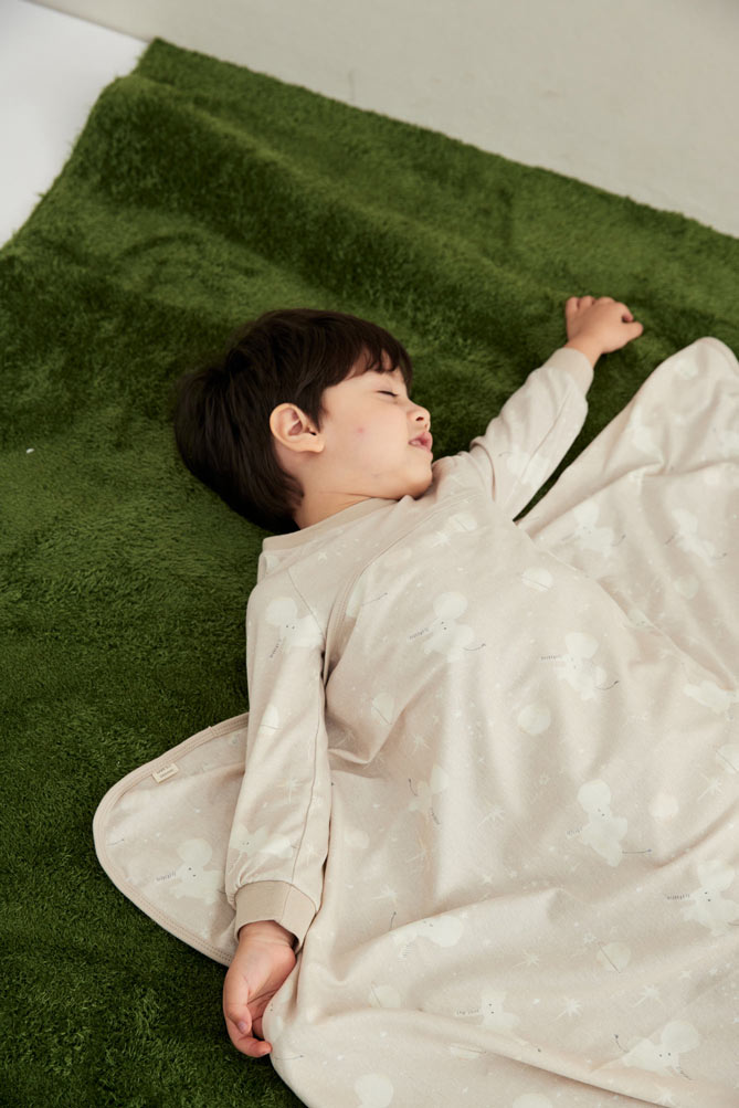 Model sleeping and wearing Organic Toddler Pajama Set-Stary