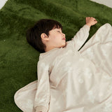 Model sleeping and wearing Organic Toddler Pajama Set-Stary