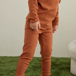 Model Wearing Toddler Organic Modal Basic Pant-Rust