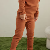 Model Wearing Toddler Organic Modal Basic Pant-Rust