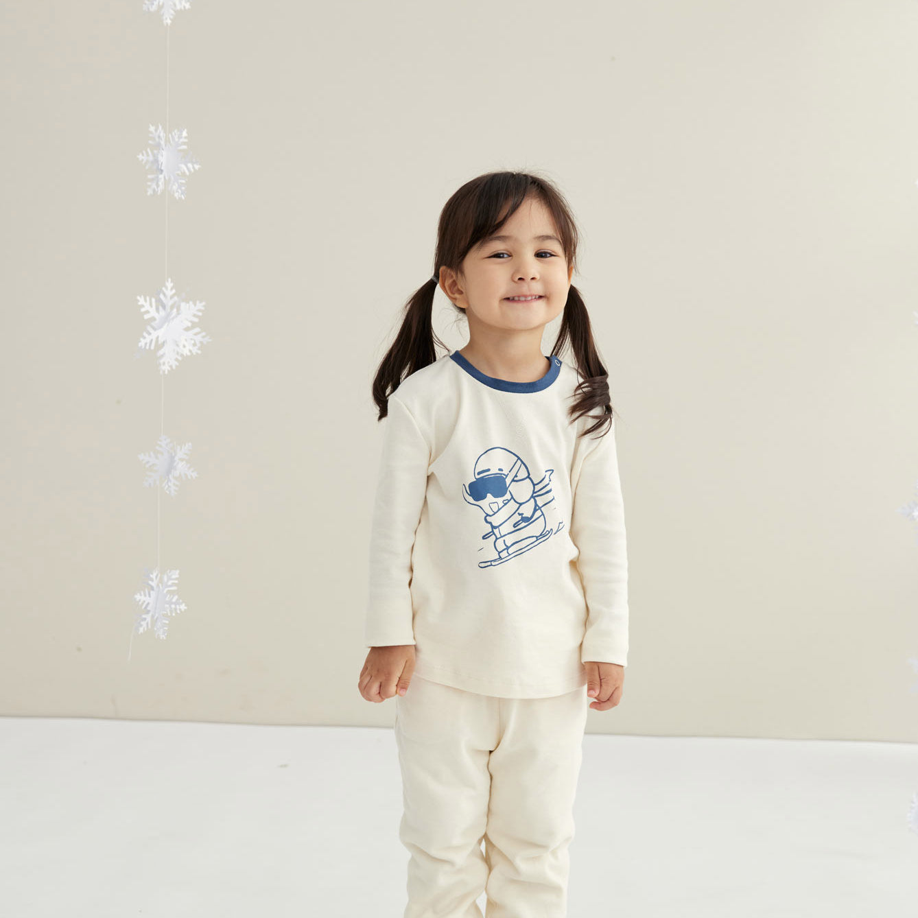 model wearing Toddler Organic Cotton Quilted Pant-Cream