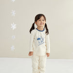model wearing Toddler Organic Cotton Quilted Pant-Cream