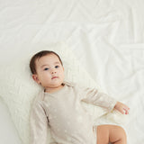 Baby laying down and wearing Baby Organic Long-sleeve Onesie-Stary