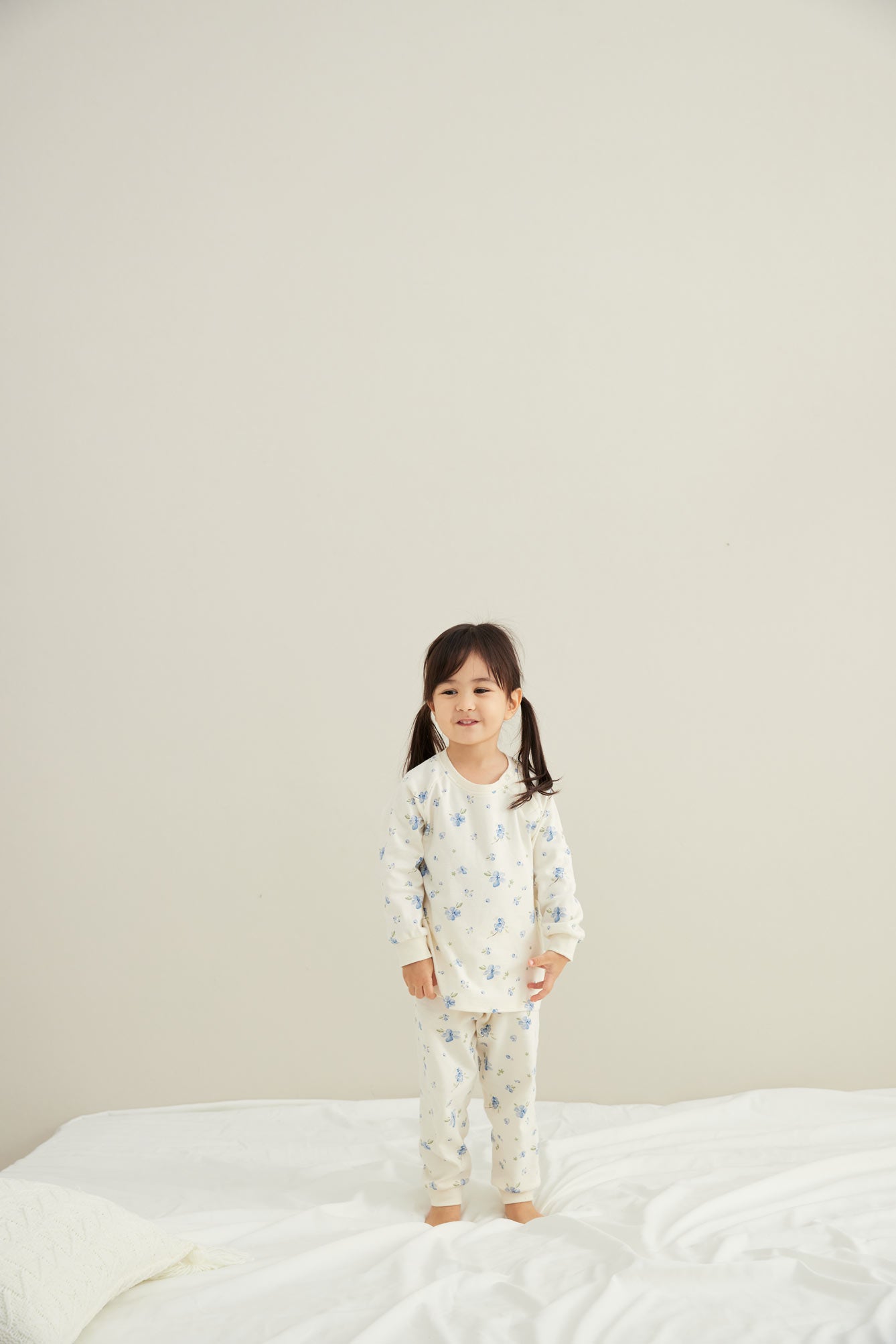baby standing wearing Organic Toddler Pajama Set-Blueberry