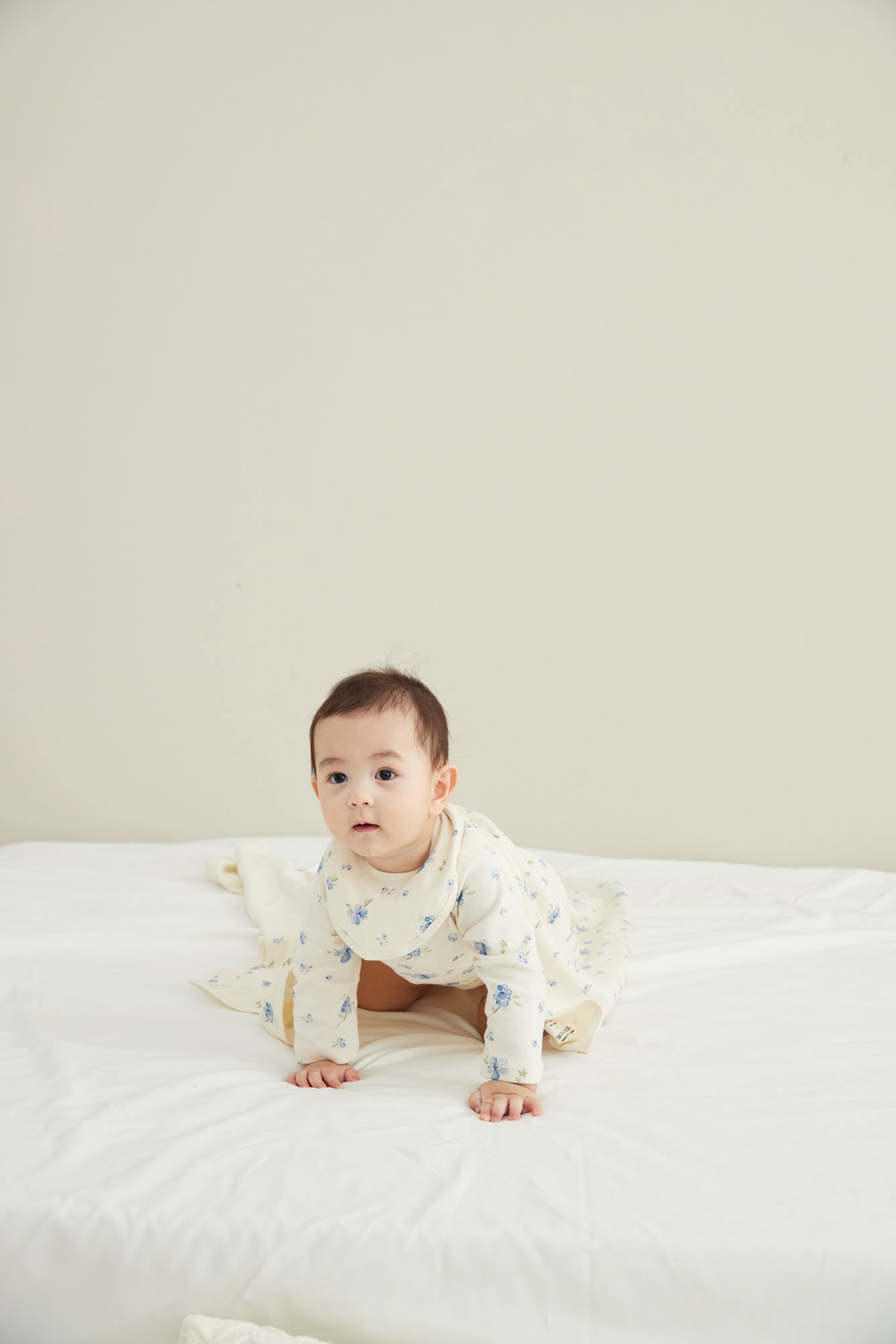 Model Wearing Baby Organic Long-sleeve Onesie-Blueberry