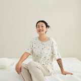 model sitting and wearing Women Short-sleeve Organic PJ Set-Blueberry