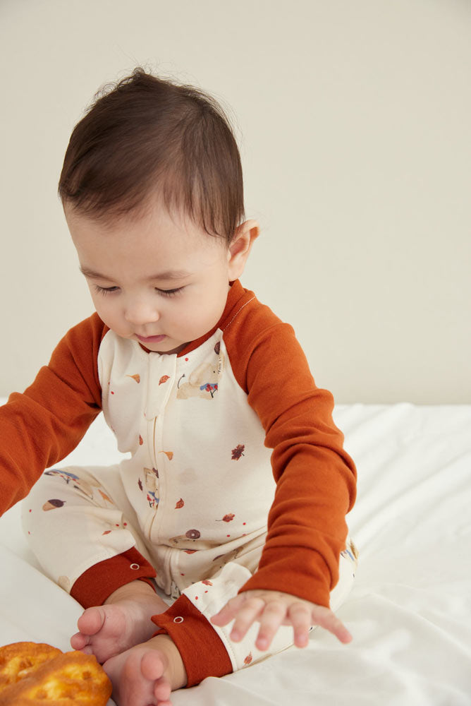Model wearing Baby Organic Cotton Zip-up Sleeper-Maple Leaf