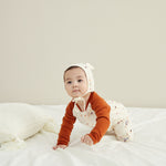 Model Wearing Baby Organic Cotton Zip-up Sleeper-Maple Leaf