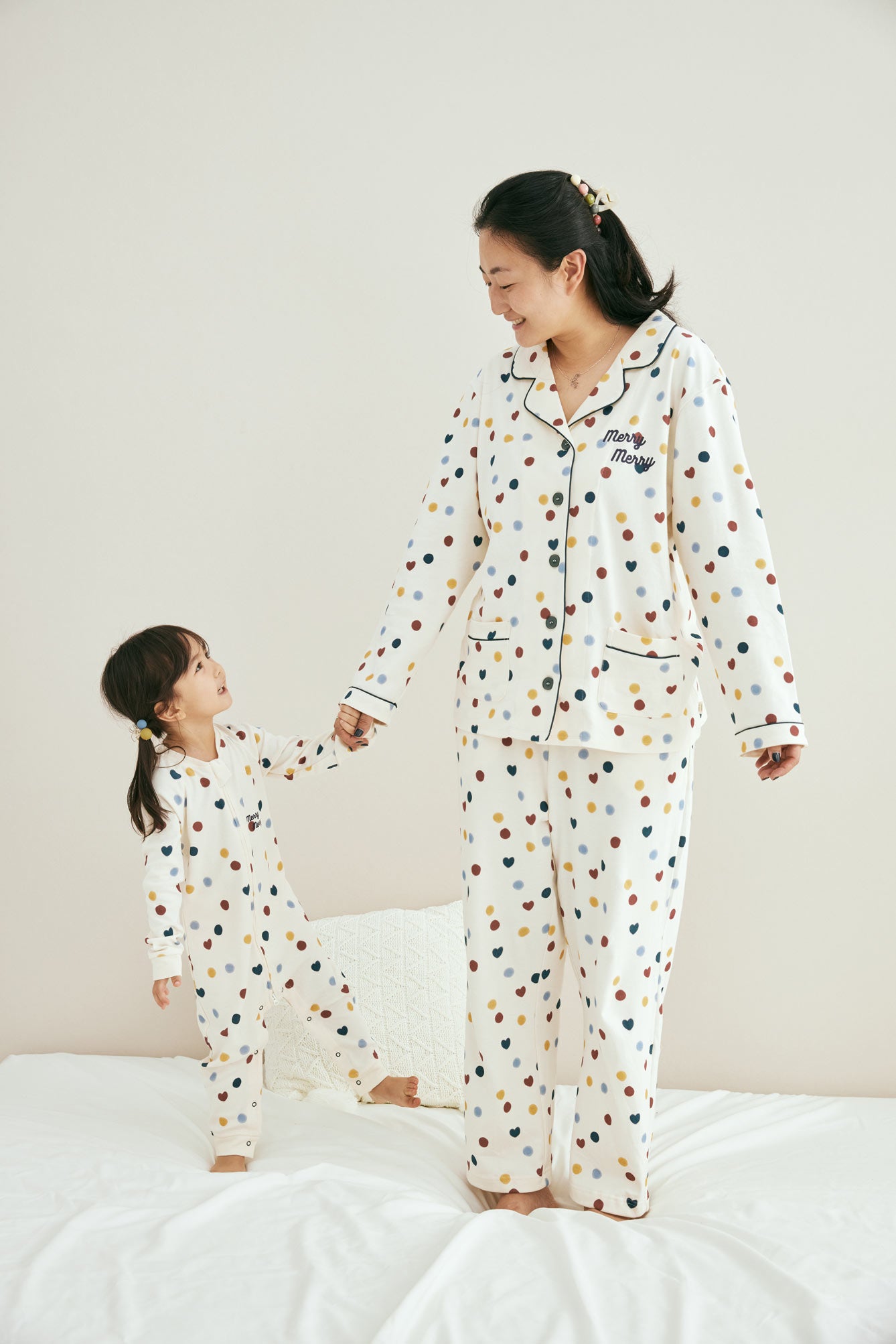 Model with her daughter wearing matching pajama set