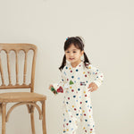 Model wearing Baby Organic Cotton Zip-up Sleeper-Merry Dots
