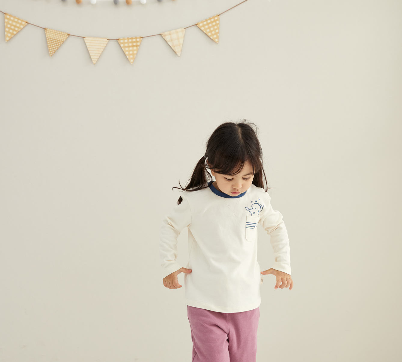 model walking and wearing Toddler Organic Cotton Quilted Pant-Heather