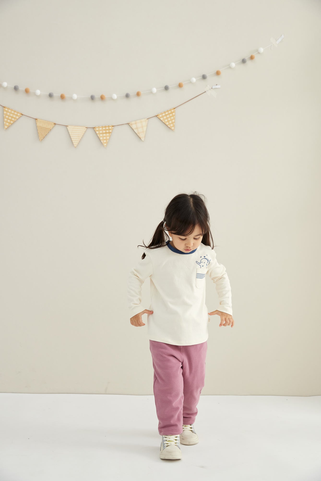 model walking and wearing Toddler Organic Cotton Quilted Pant-Heather