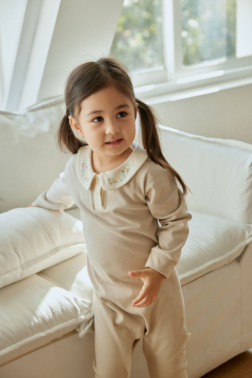baby stand beside sofa and wearing collar bodysuit-lightgrey