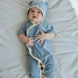 baby boy laying on the bed and wearing Baby Organic Kimono Sleeper-Blue Starry