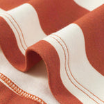 detail of Toldder Organic Polo Shirt-Rust/Cream