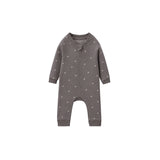 A baby long-sleeve footless one-piece romper in dark gray with a small white polka dot pattern, shown against a plain white background.