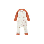 A baby long-sleeve footless one-piece jumpsuit in off-white with a small woodland animal and acorn print, featuring rust-orange raglan sleeves and cuffs, shown on a plain white background.