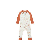 A baby long-sleeve footless one-piece jumpsuit in off-white with a small woodland animal and acorn print, featuring rust-orange raglan sleeves and cuffs, shown on a plain white background.