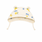 Baby hat with lemon and star pattern on a white background