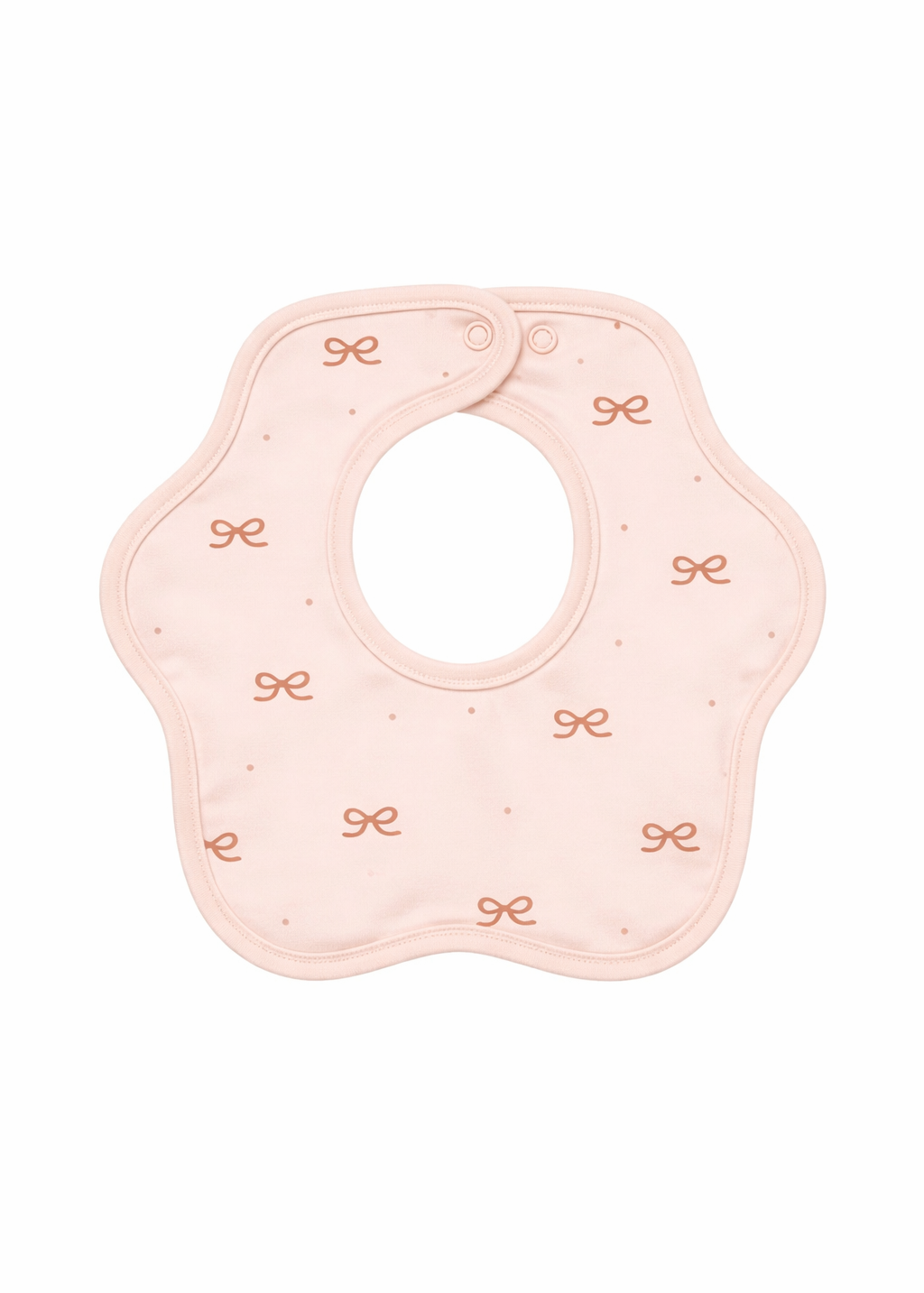 Pink baby bib with decorative elements on a white background