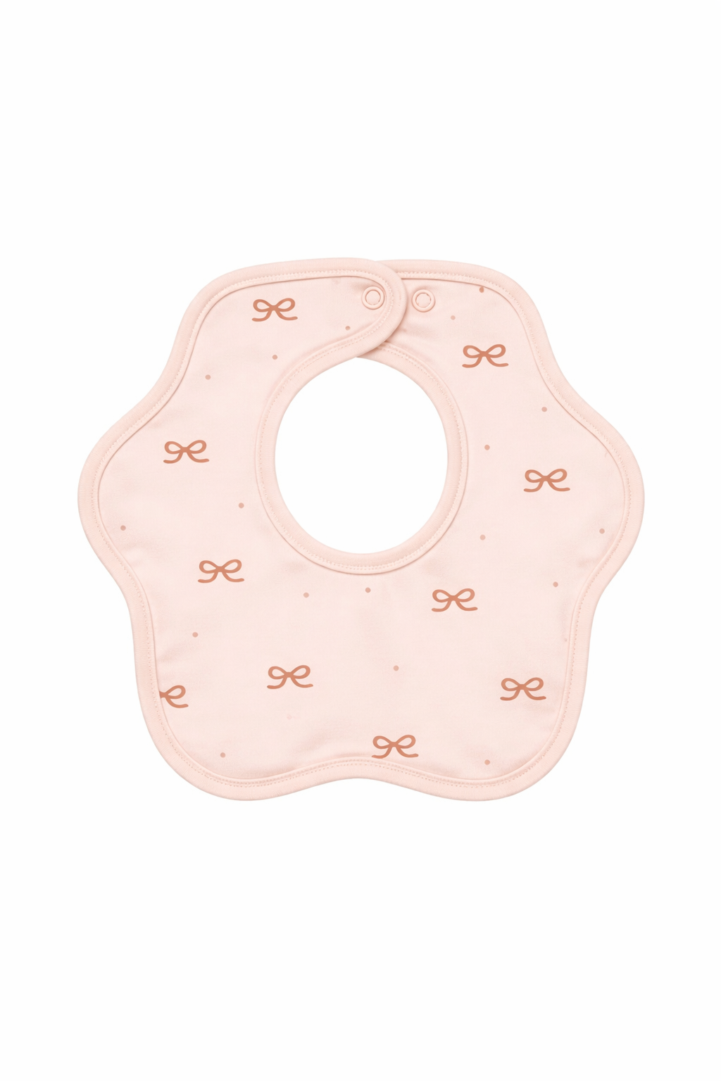 Pink baby bib with decorative elements on a white background