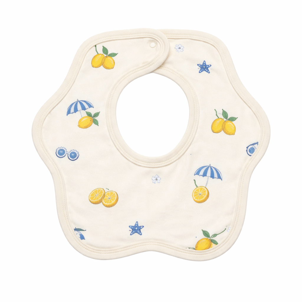 Baby bib with lemon and blue umbrella pattern on a white background