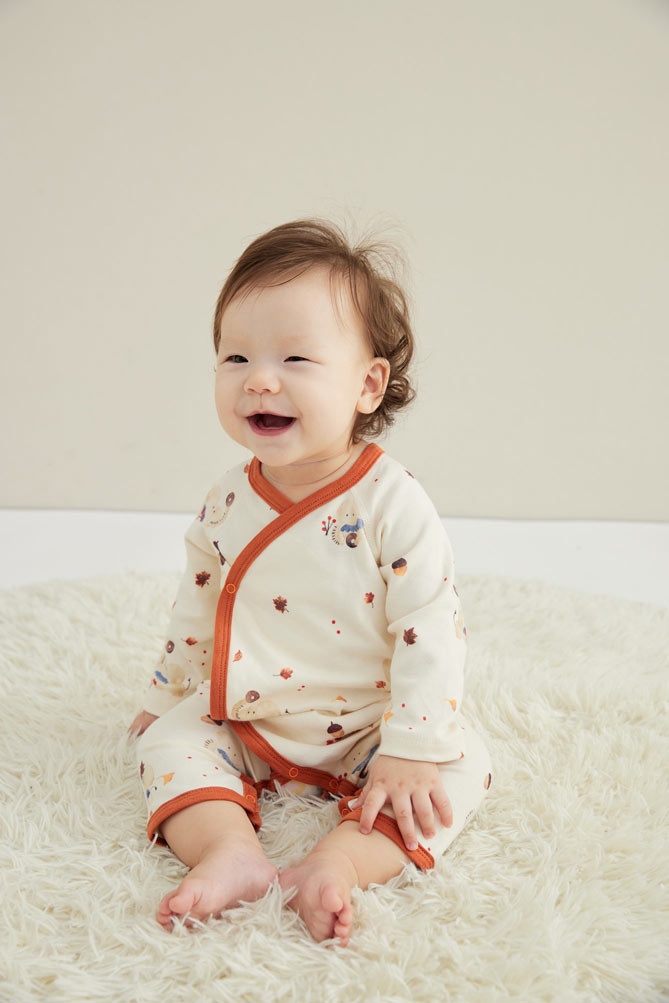 Model wearing Baby Organic Kimono Sleeper-Maple Leaf