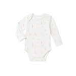 White baby onesie with pink floral pattern on a white background