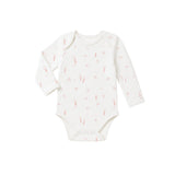 White baby onesie with pink floral pattern on a white background