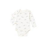 White baby onesie with small pattern on a white background