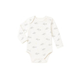 White baby onesie with small pattern on a white background