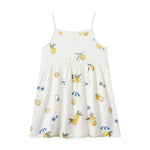 White dress with lemon print on a white background