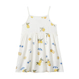 White dress with lemon print on a white background