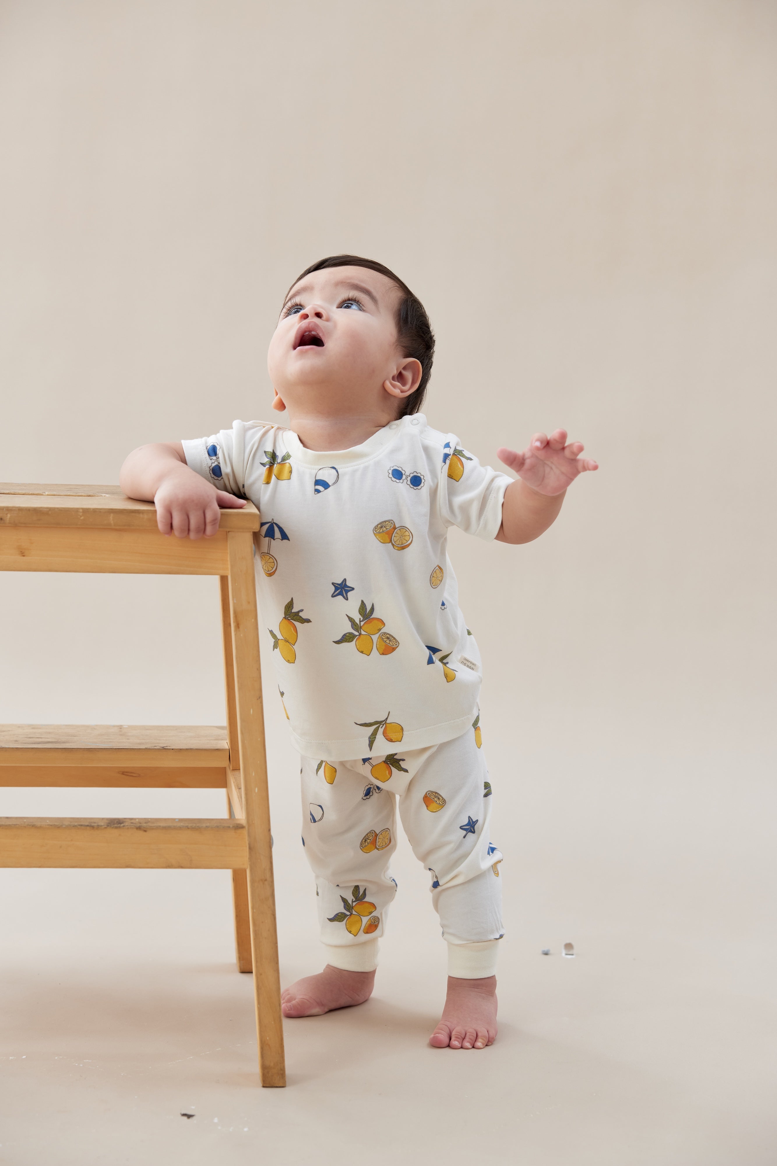 Baby wearing a lemon print bamboo summer pajama set