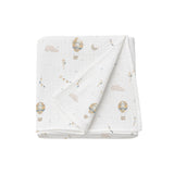 Folded baby blanket with hot air balloon pattern on a white background