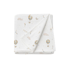 Folded baby blanket with hot air balloon pattern on a white background