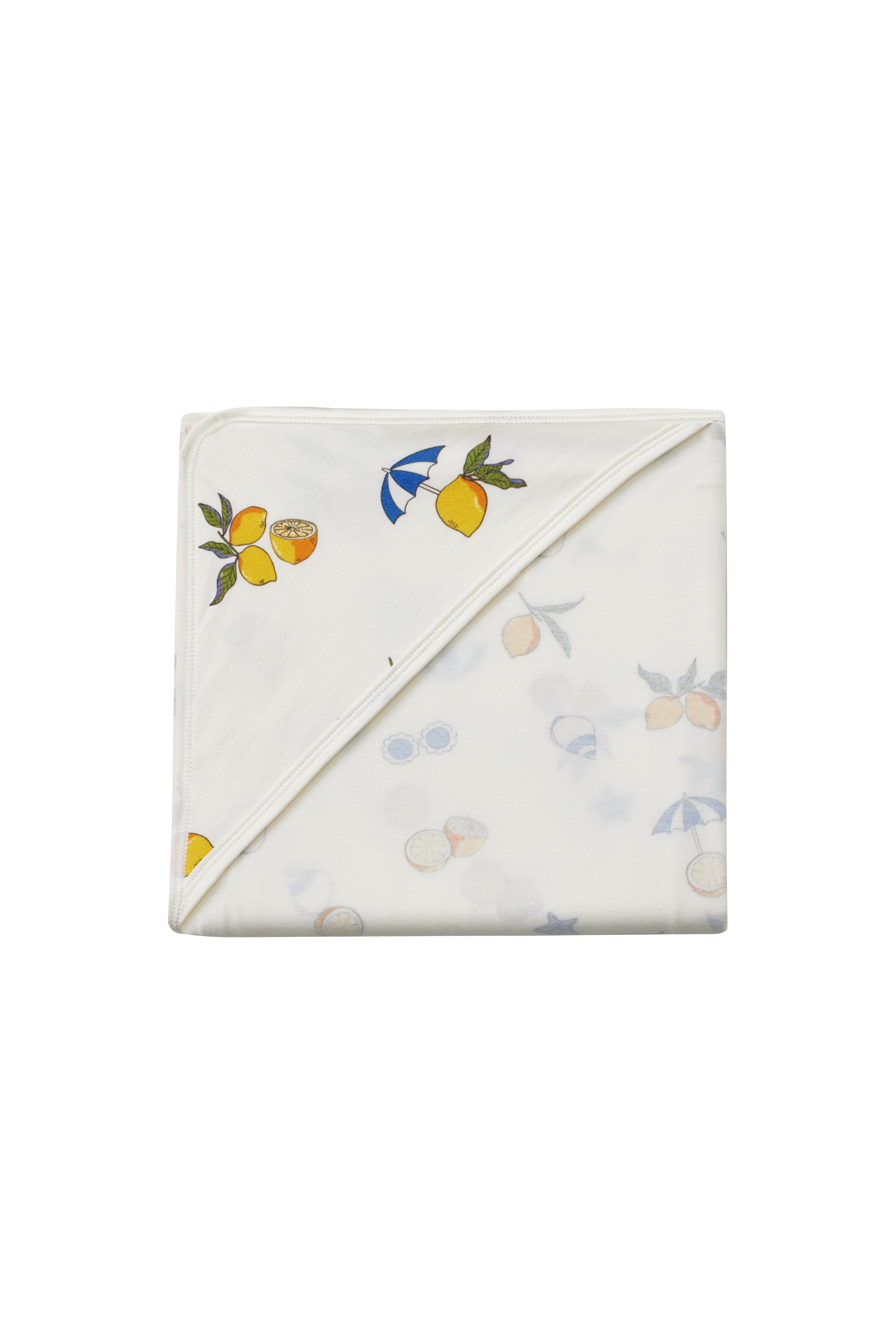 Folded towel with fruit pattern on a white background