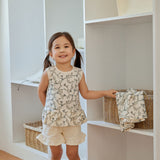 baby is holing a basket beside the closet 