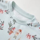 Baby pajama with Christmas-themed print on a light blue background