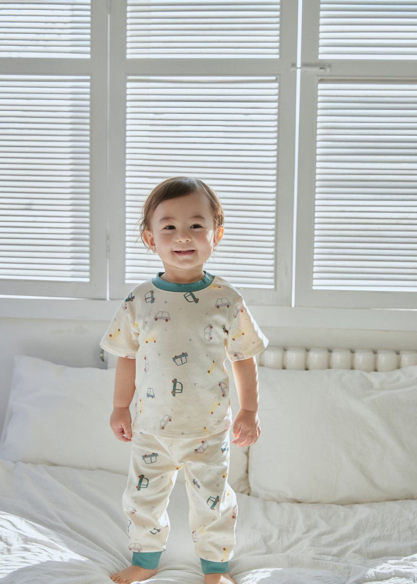 baby boy standing on the bed