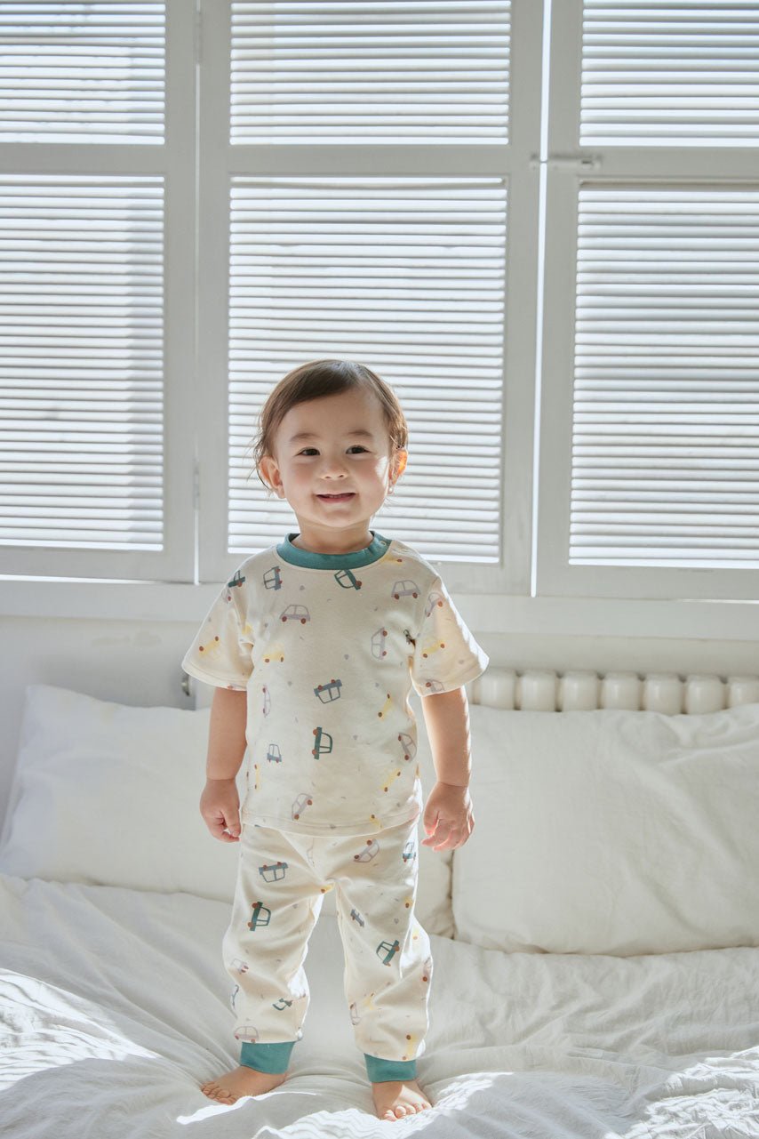 baby boy standing on the bed