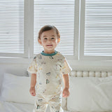 baby boy standing on the bed