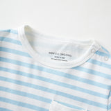 Close-up of a blue and white striped shirt with a brand label and pocket design.